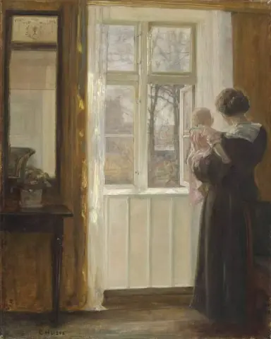 Una madre e un bambino ad una finestra