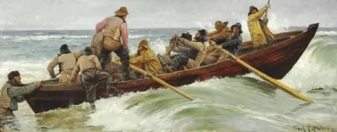 Das Rettungsboot geht aus. Die Retter gehen an Bord, der letzte ist noch im Wasser