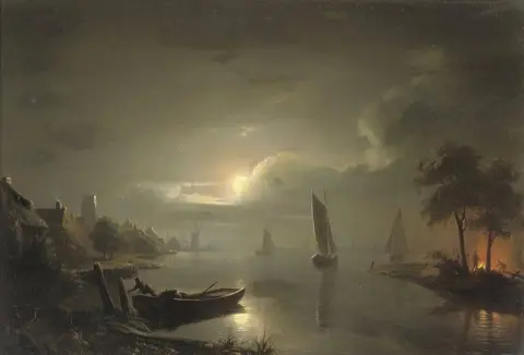Navigazione notturna vicino a Rotterdam con la St. Laurenskerk al di là